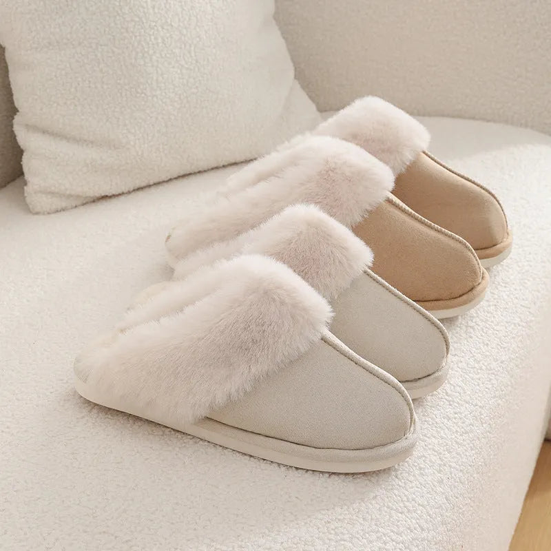 Women's plush winter slippers in pink with a round toe, flat heel, and anti-slip PVC sole.