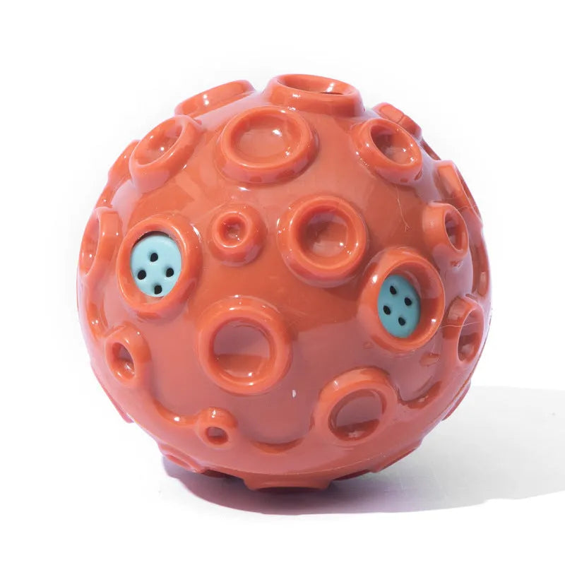 Colourful natural rubber dog chew ball with textured surface and meteorite-shaped bumps
