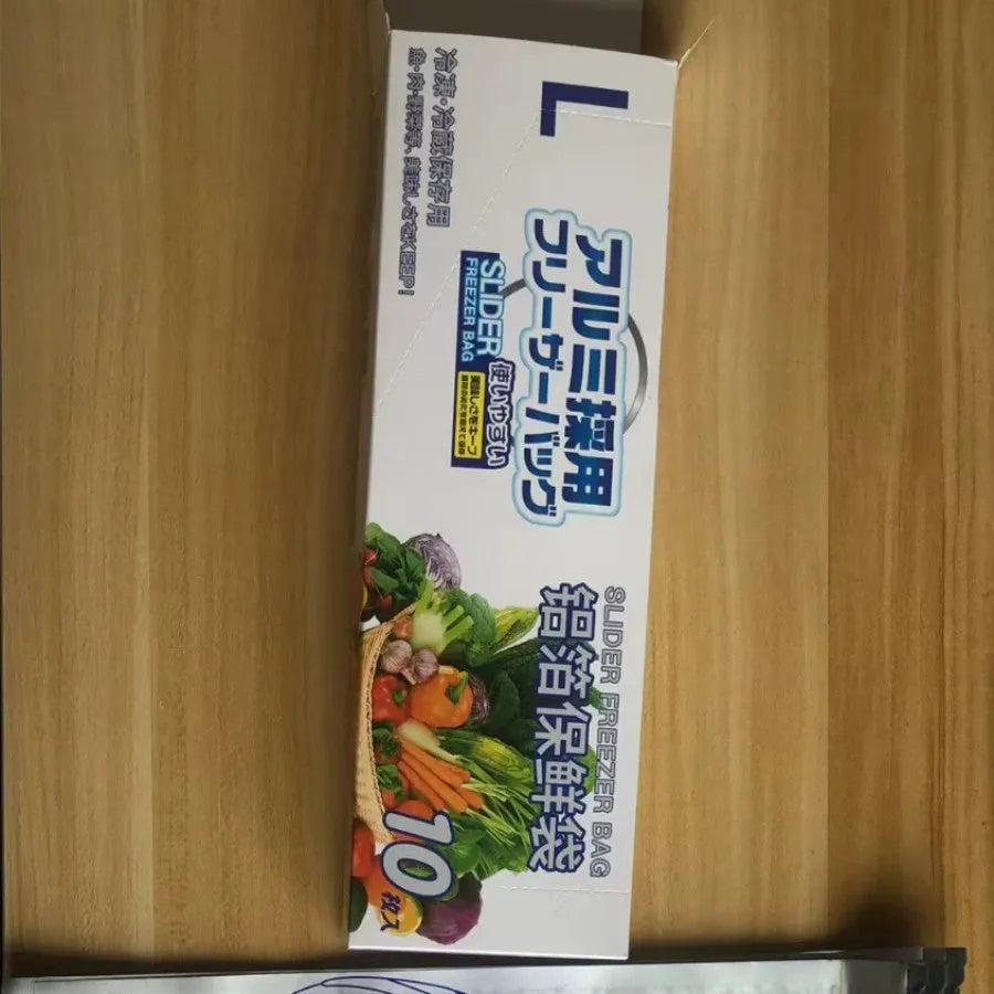 Set of aluminium foil sealed fresh bags and boxes in three sizes for food storage.