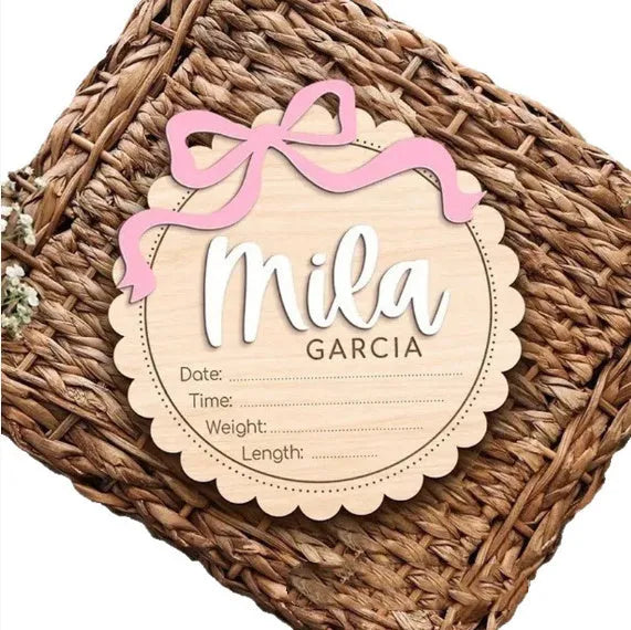 Square wooden baby room ornament with customised name engraving, shown in two size options.