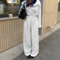 White striped wide-leg trousers with zipper details on polyester fabric for office commuting