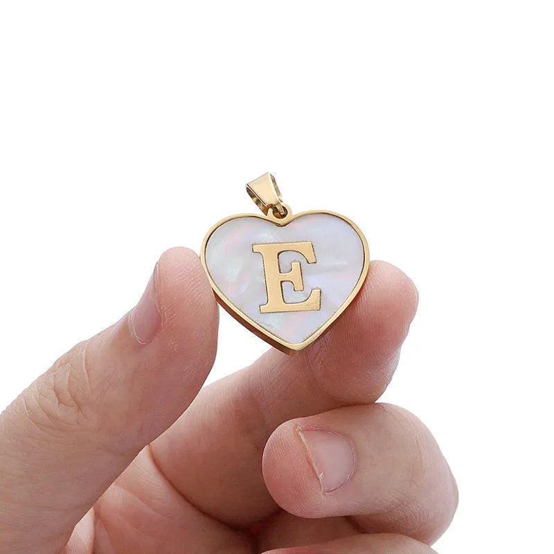 Gold-plated stainless steel necklace with a letter pendant and heart charm on a 45+5cm chain.