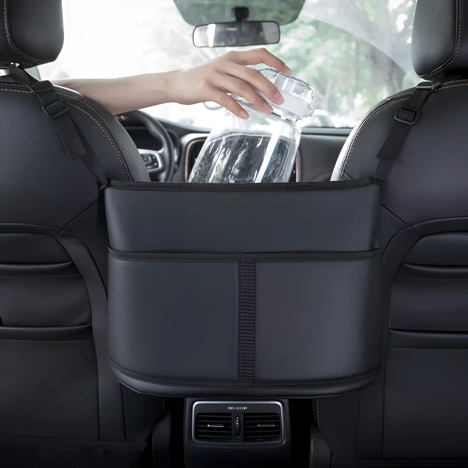 Black leather car seat storage bag with carbon fibre pattern measuring 38 by 24 by 15 centimetres