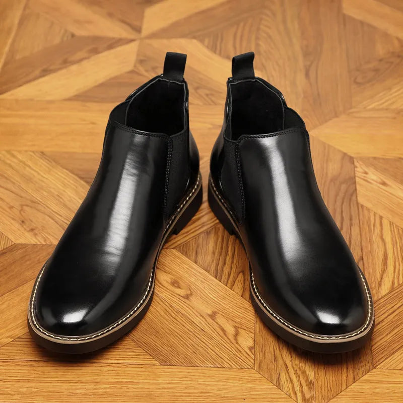 Men's black formal leather ankle boots with pointed toe and square heel on white background