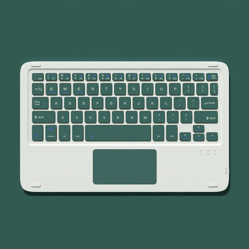 Pink Bluetooth touch keyboard and rechargeable mouse on a desk next to a tablet.
