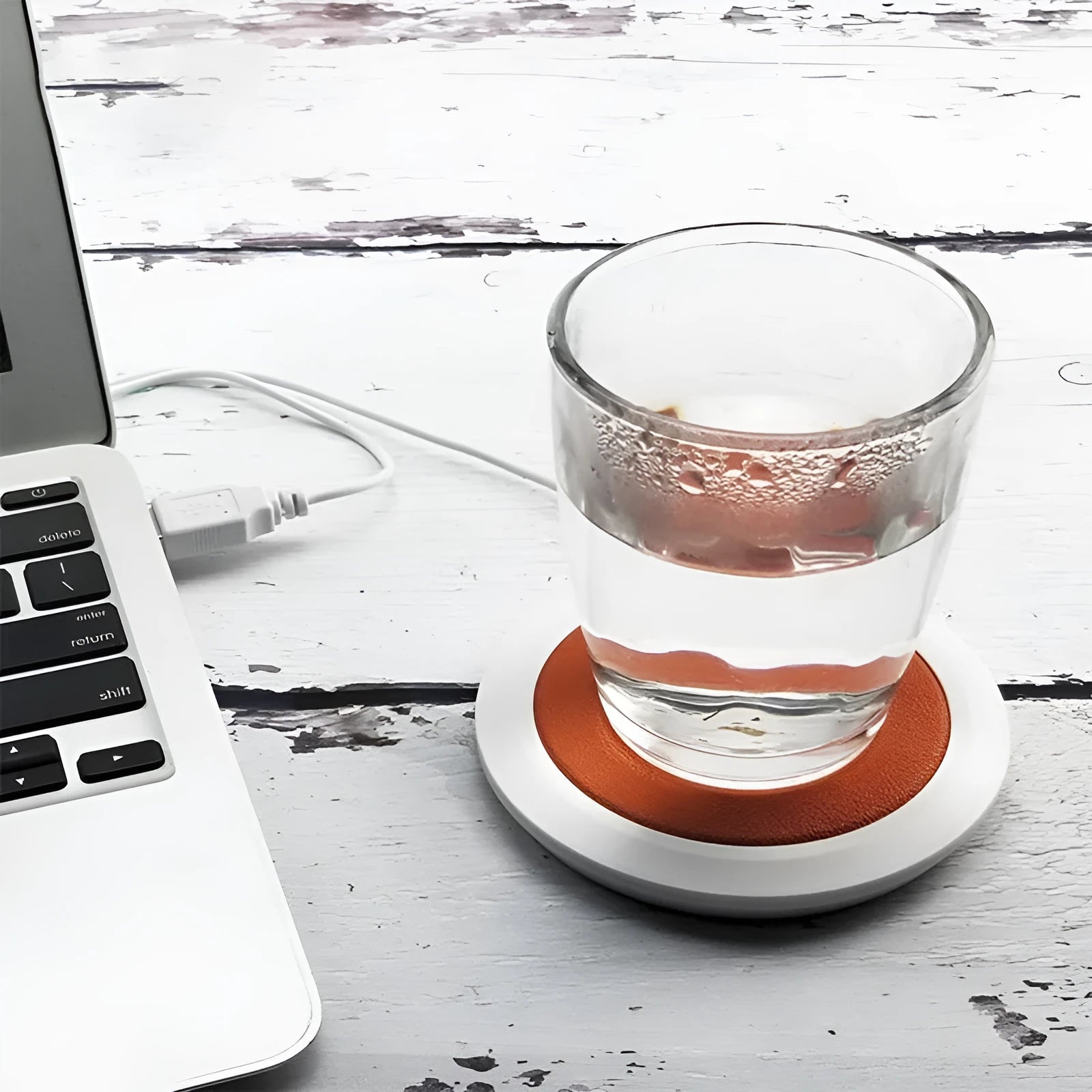 USB heating coaster in black, blue, and orange colours with insulated design