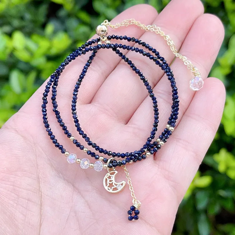 Women's blue and gold three-ring multi-layer bracelet with sand stone beads.
