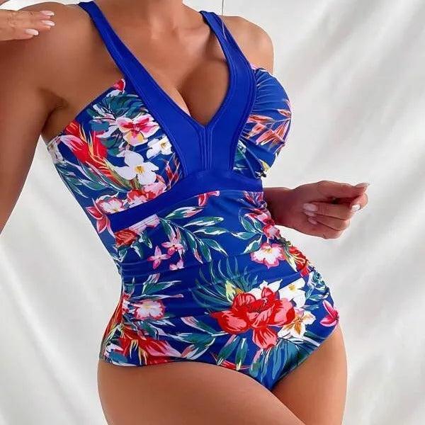 Women's floral pattern backless one-piece swimsuit on a hanger
