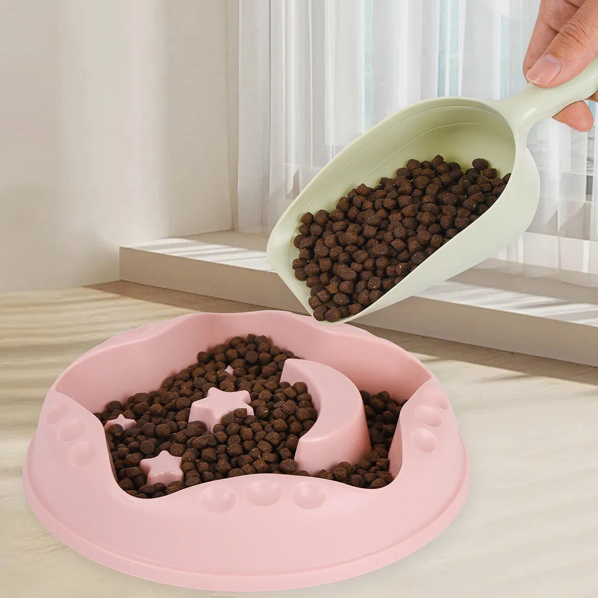 Moon, star, and wing-shaped slow feeder dog bowl in selected colour, showing large capacity food and water design.
