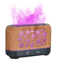 Wood grain snowflake pattern aromatherapy humidifier with colourful flame effect lighting on desktop