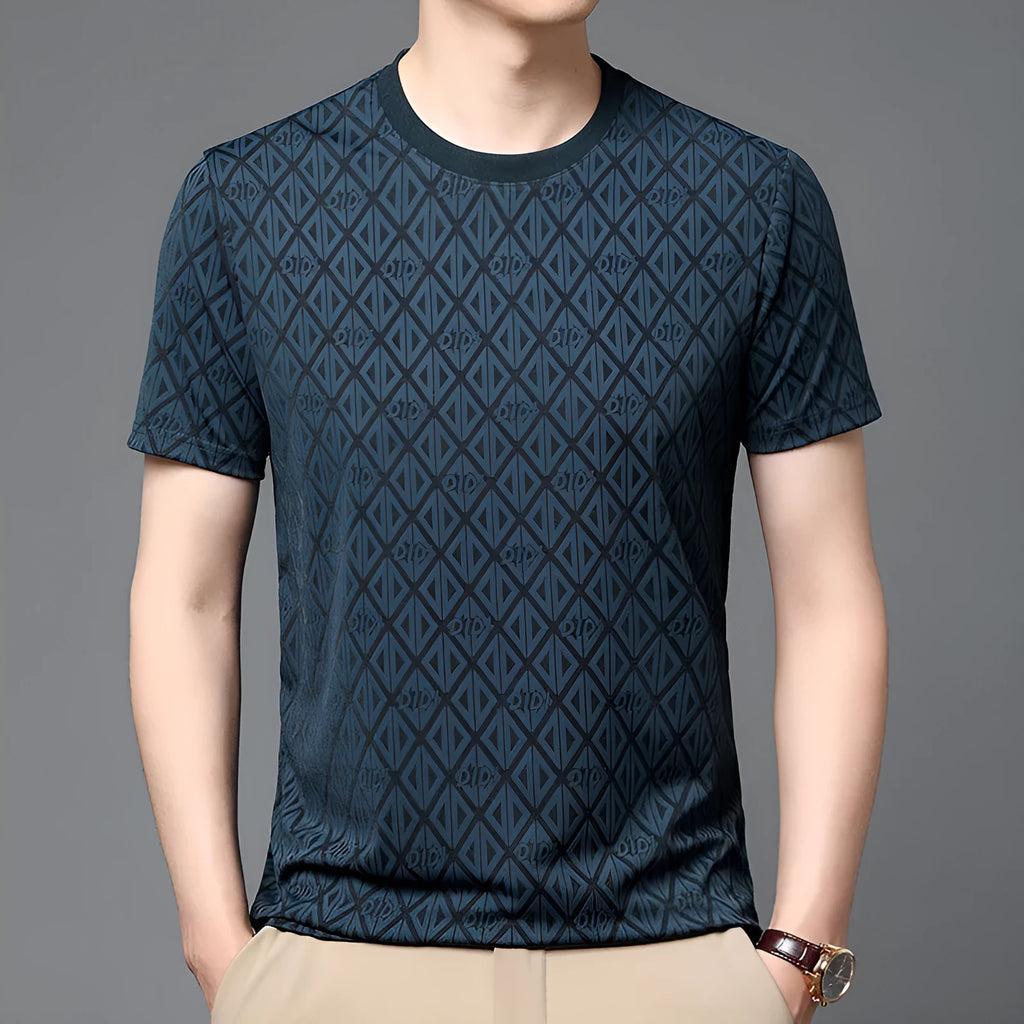 Man wearing a loose fit black Jacquard short sleeve T-shirt with a round neckline.