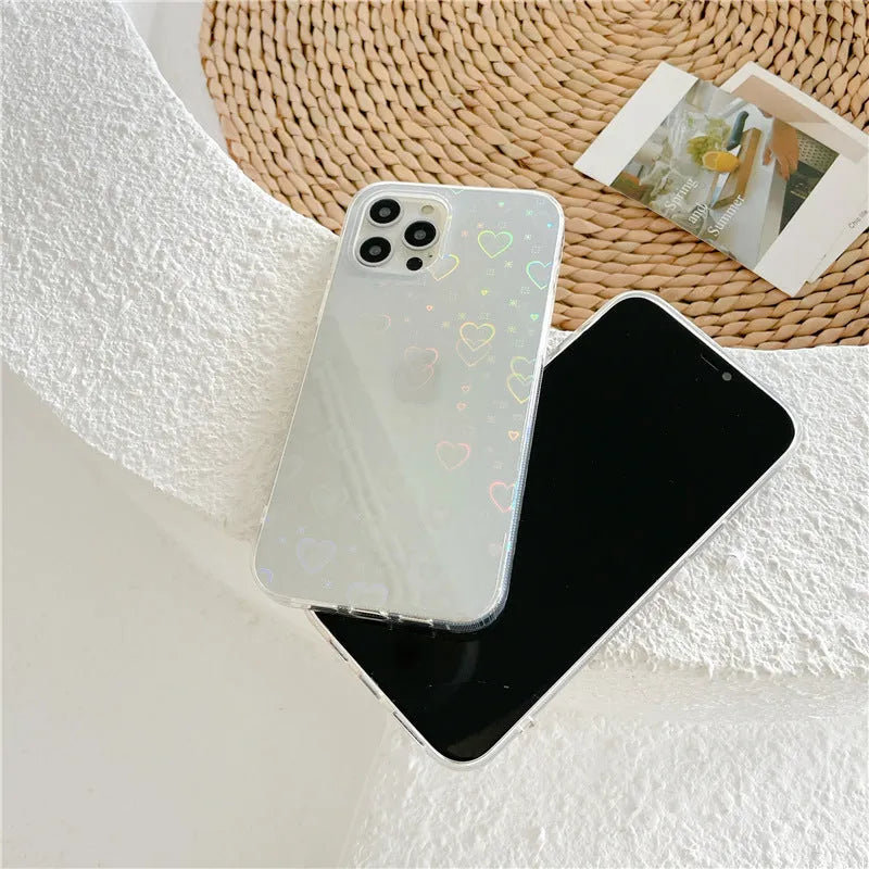 Translucent silicone iPhone case with a laser-etched love heart pattern on the back.