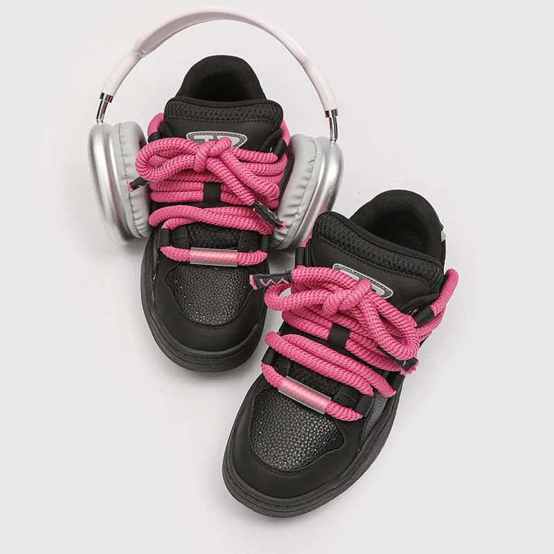 Low-top lace-up casual sneakers in denim blue with a round toe and thick rubber sole.