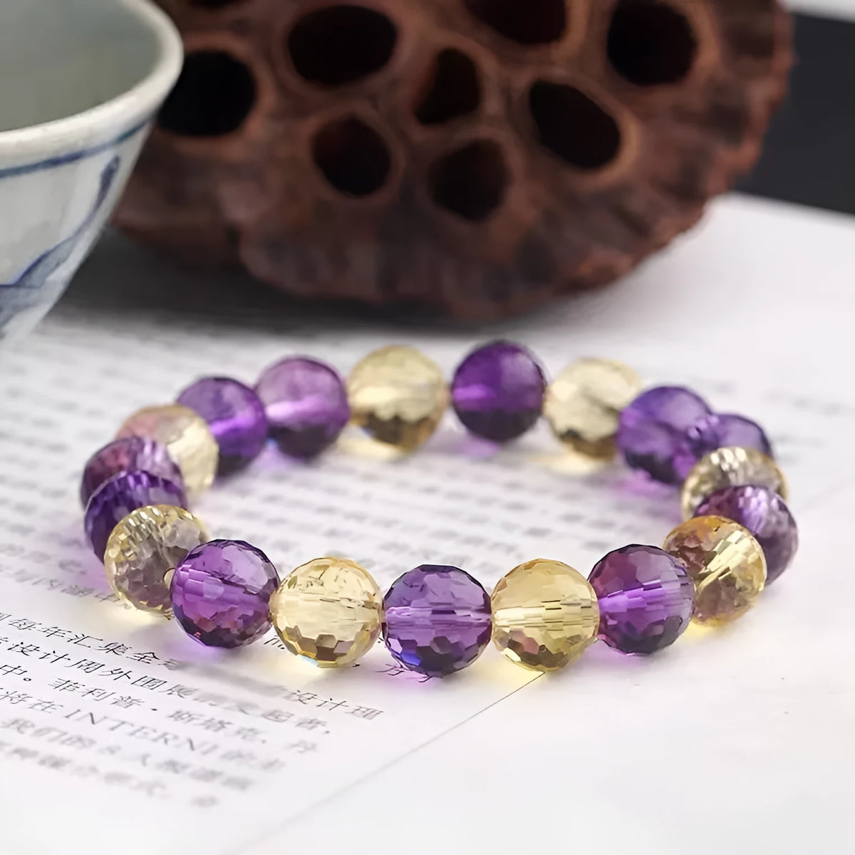 128-facet crystal ametrine bracelet with zodiac designs in multiple bead sizes