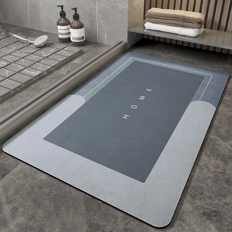 Blue oval blended fabric bathroom floor mat placed on tiled floor.