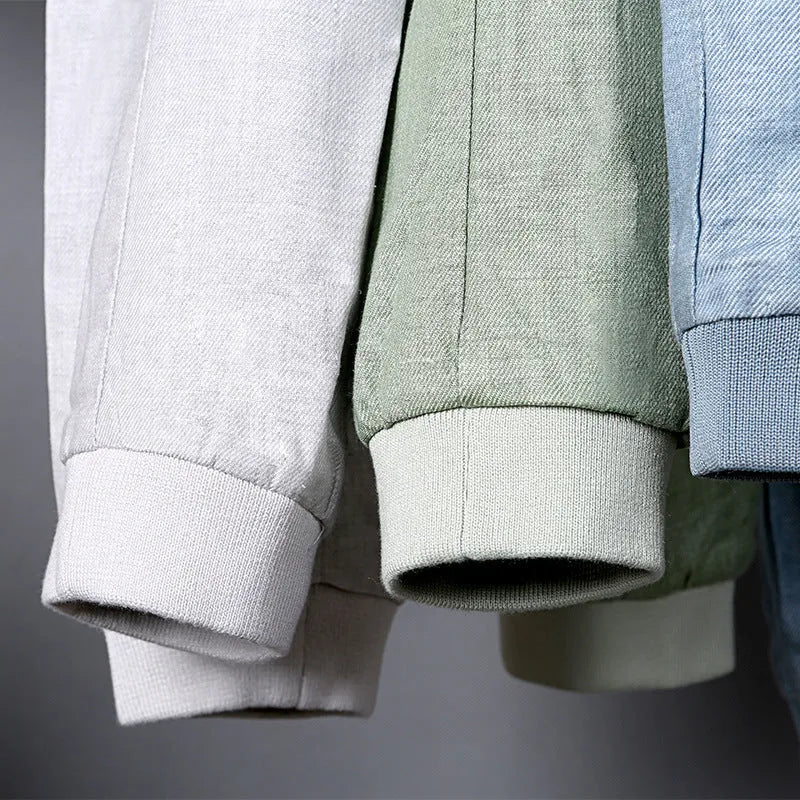 Men's blue cotton linen jacket on a hanger, showing regular fit and button front.