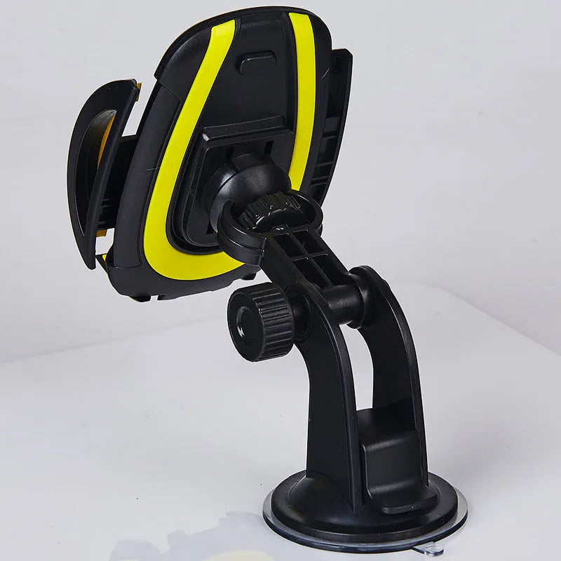Red ABS plastic car phone holder with U-shaped clamp and suction cup mount on a dashboard.