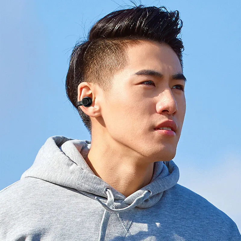 Wireless Bluetooth clip-on headset with bone conduction technology in black and white colour options