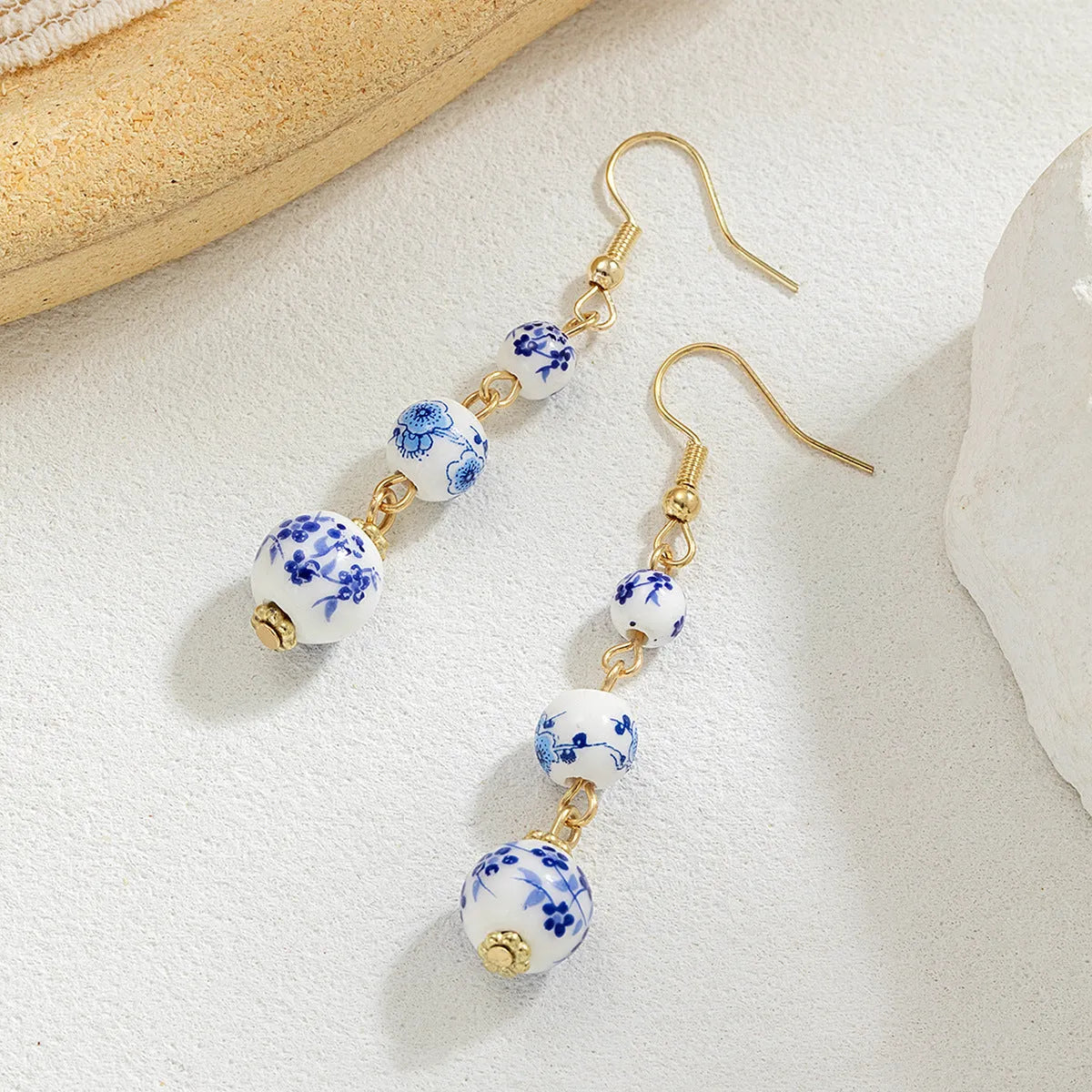 Blue and white porcelain ceramic bead retro earrings with geometric alloy electroplated construction