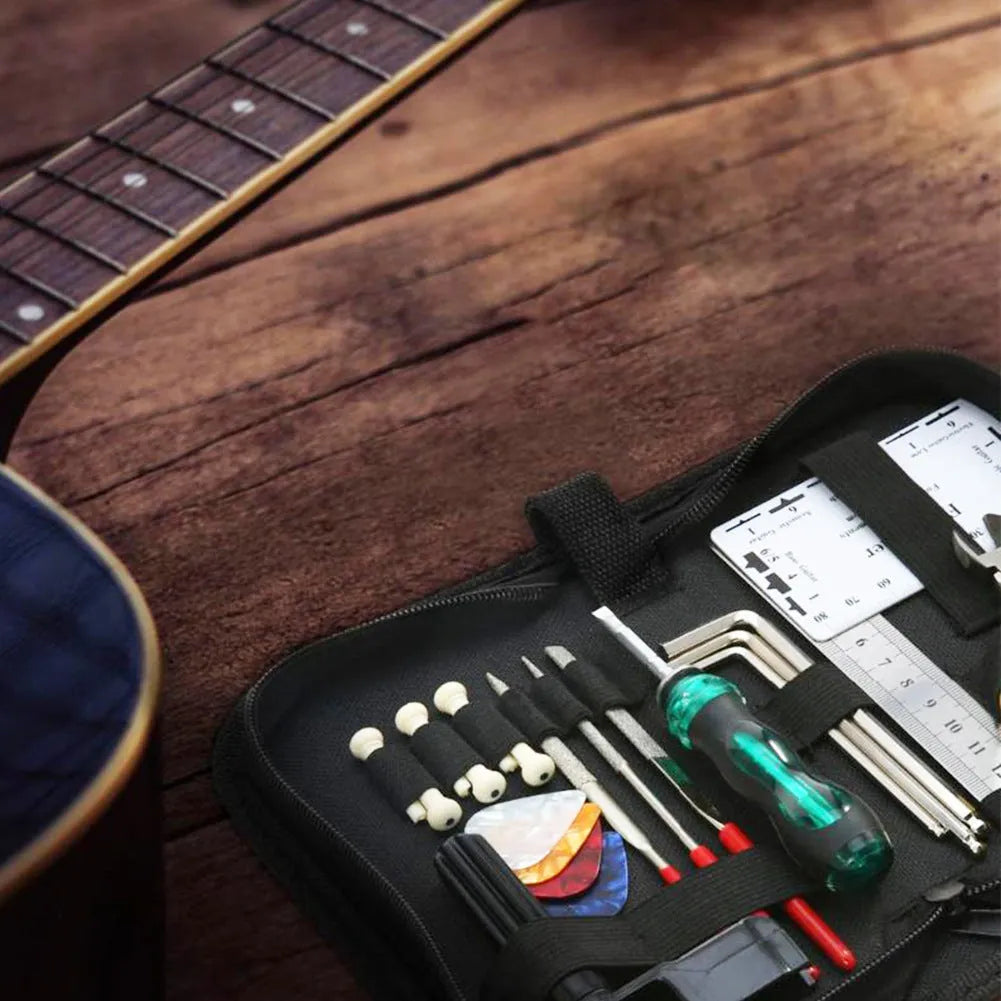 Black plastic guitar repair tool kit for guitars, bass, mandolin, and banjo, showing closed case.