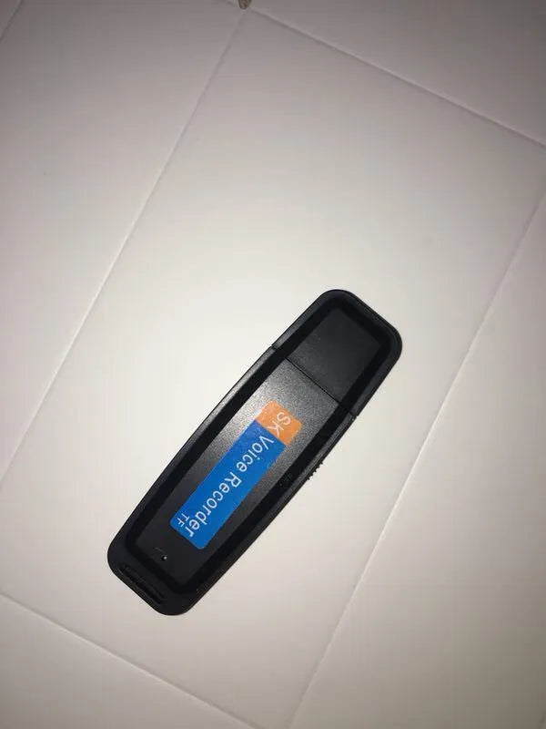 Black and white SK-001 creative USB flash drive showing compact size
