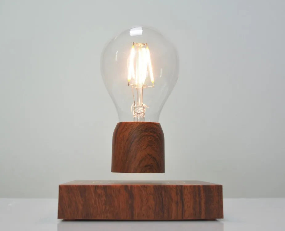 Magnetic levitation floating bulb lamp with glass bulb and imitation wood base