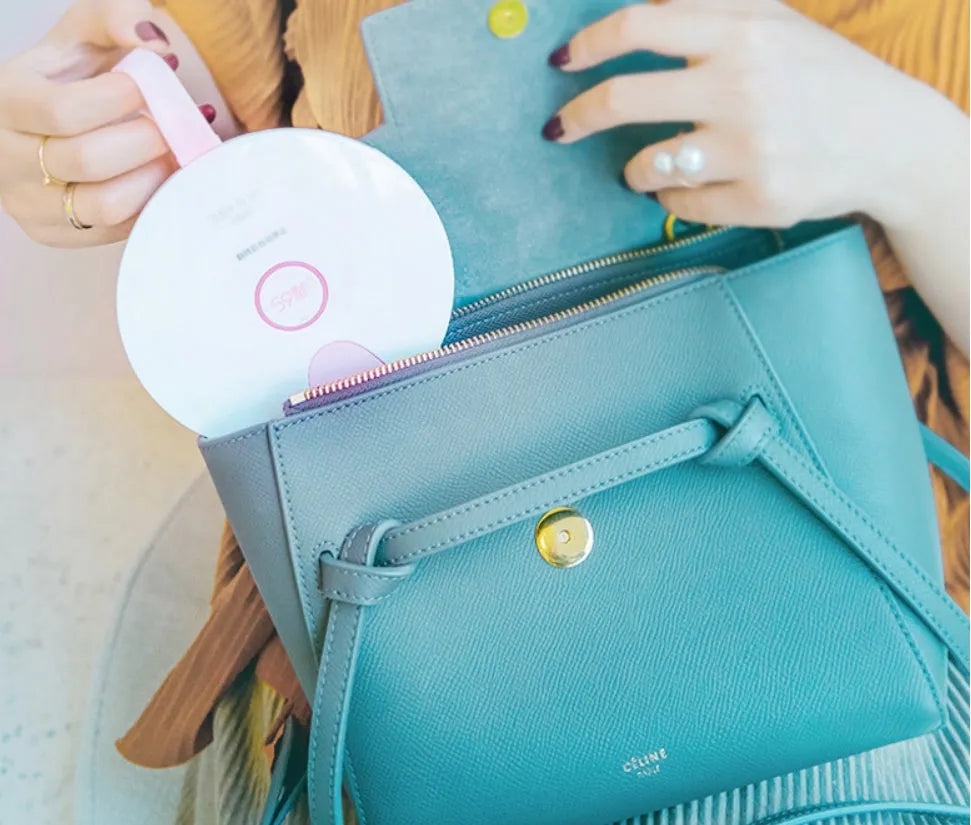 Blue portable baby bottle steriliser with USB cable, showing compact slim design.