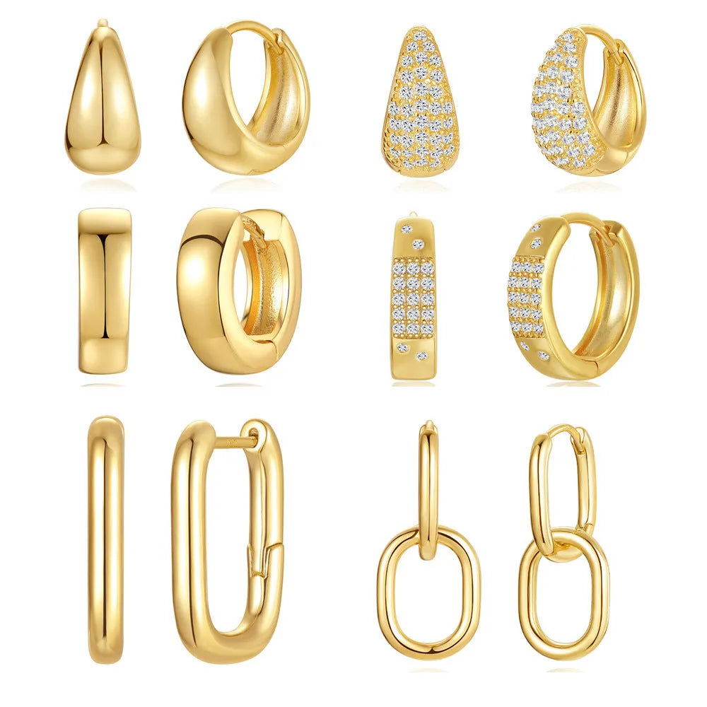 A pair of simple round geometric brass earclip earrings with a gold electroplated finish.