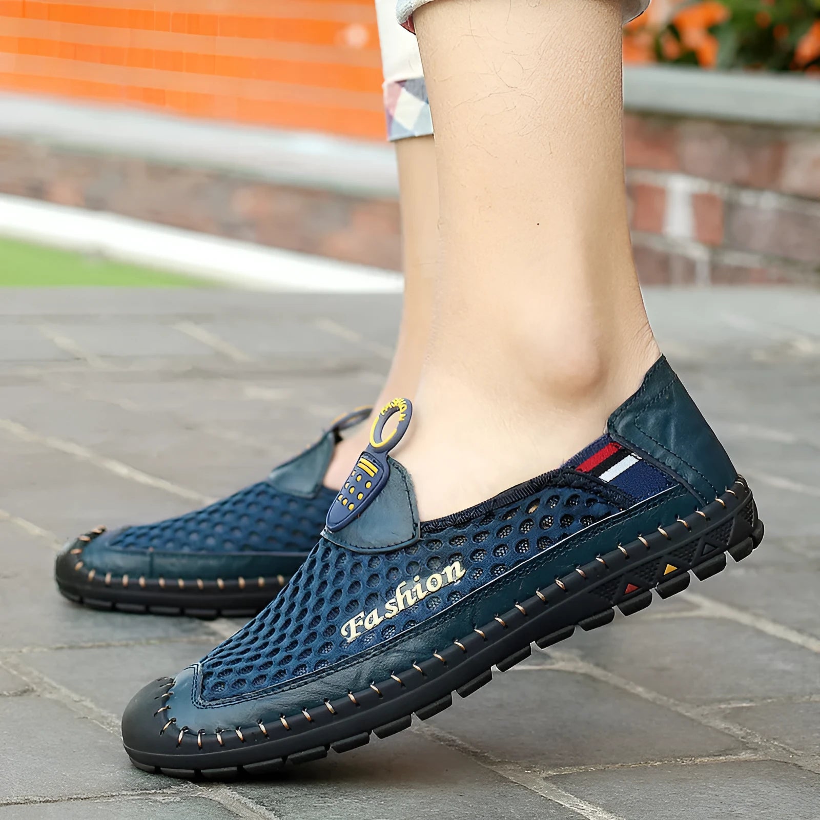 Men's brown mesh casual shoes with round toe and rubber sole on a white background.