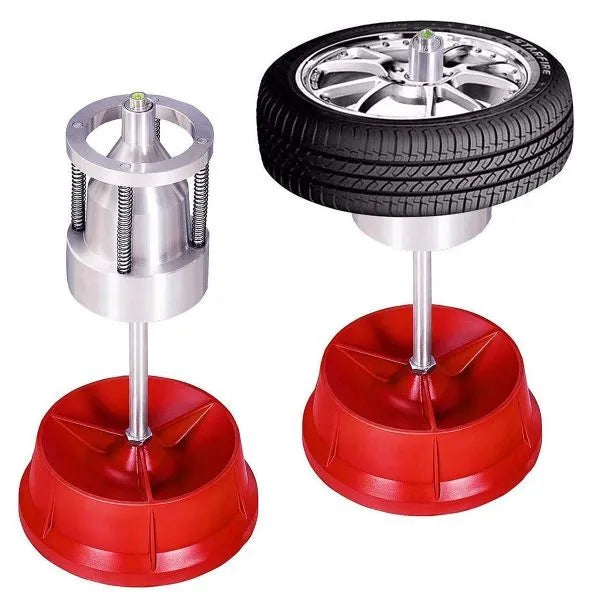 Portable hub balancer tool with aluminium head and enamel-finished base for wheel balancing.