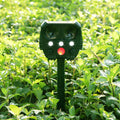 Green solar-powered ultrasonic animal repeller with dimensions 12x13x5cm