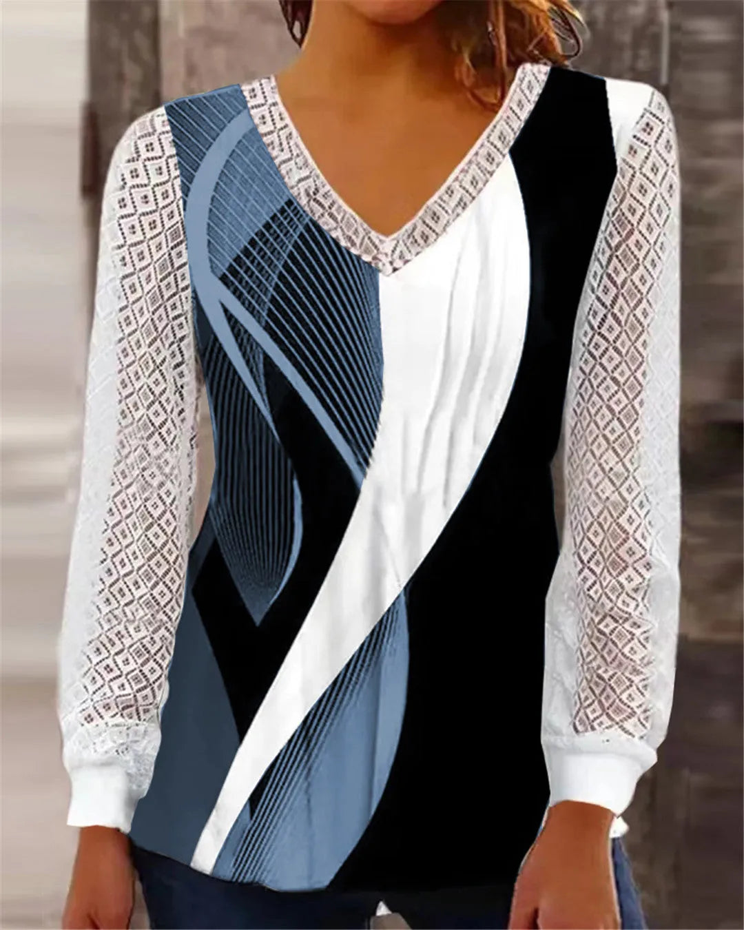 Purple loose V-neck women's top with hollow-out lace pattern and long sleeves.