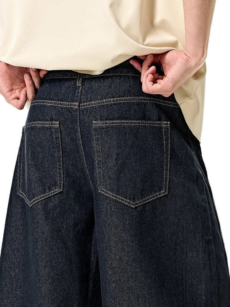 Men's wide-leg denim trousers in original cow colour, showing relaxed fit and mid-waist design.