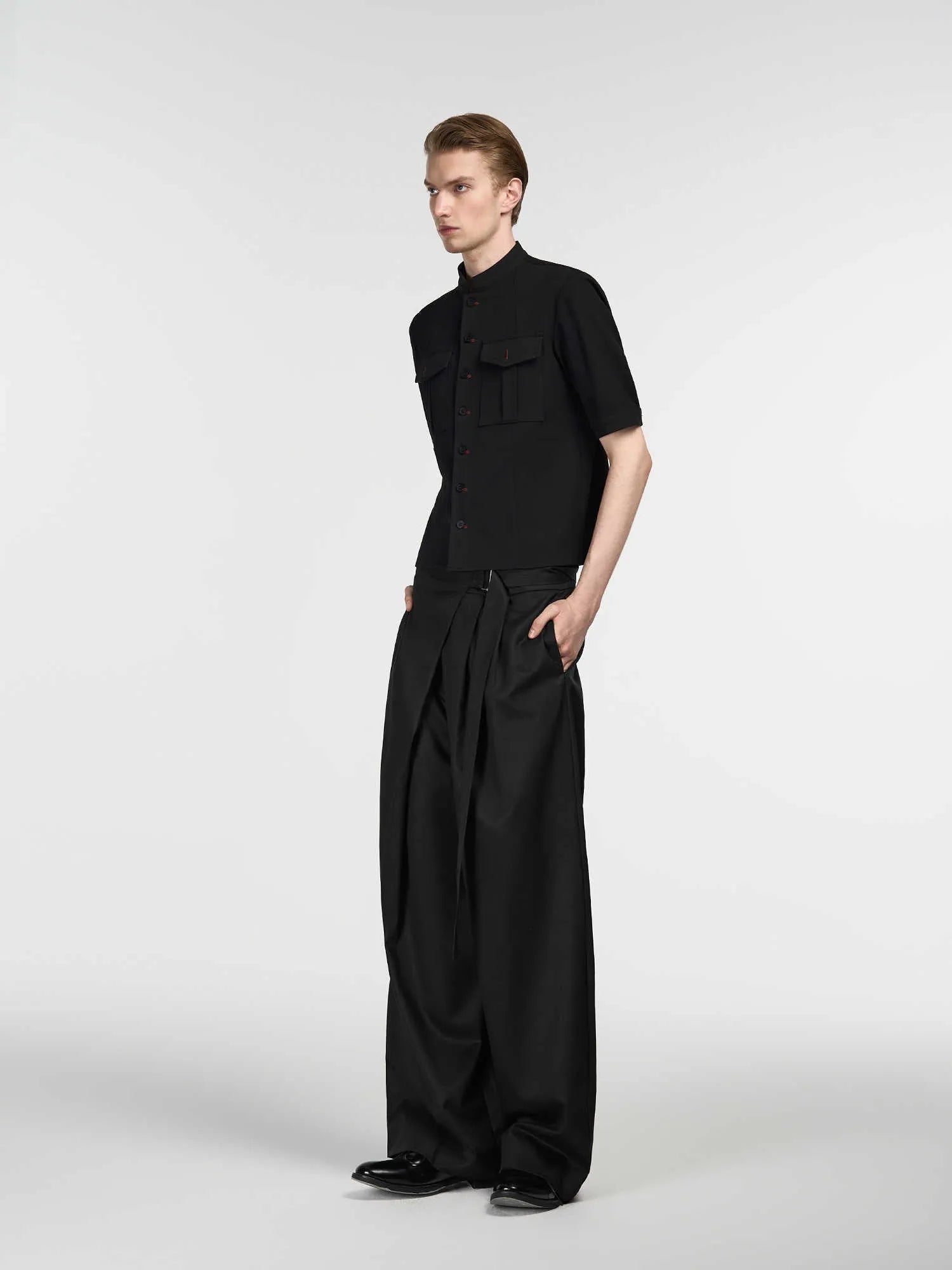 Black straight-leg trousers with single pleat front and adjustable mid waist