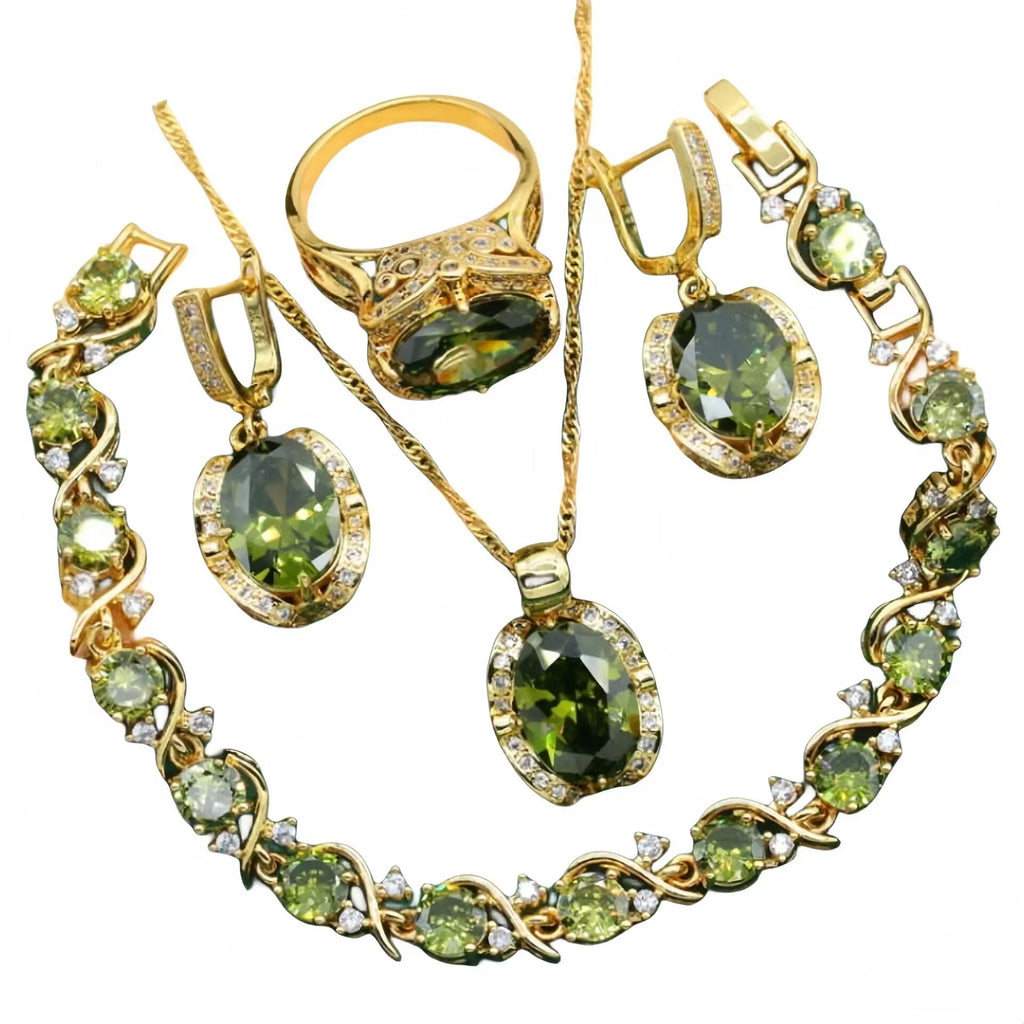 Olive green zircon stone jewellery set with cross, crown, and roman numerals pendant on a snake bones chain, plus matching earrings and ring.