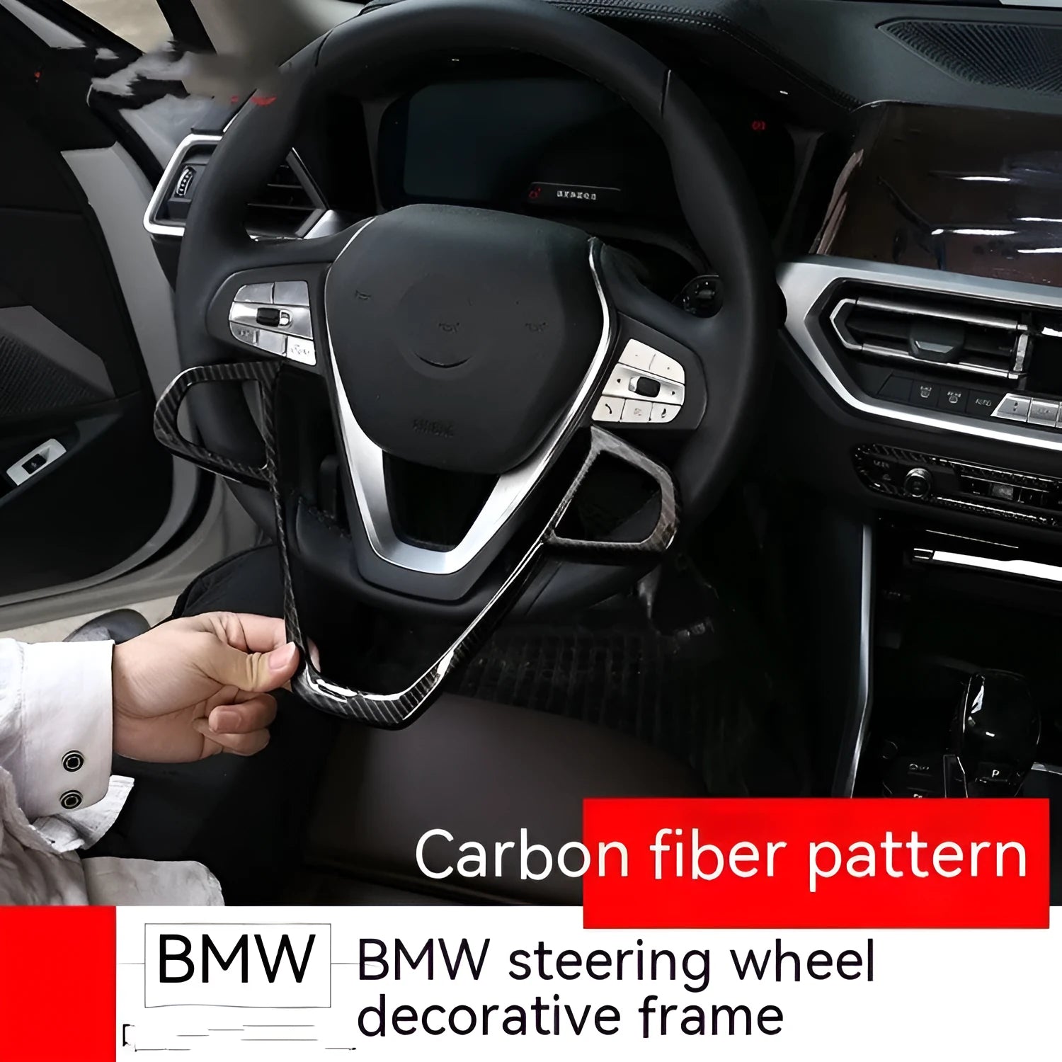 Black carbon fibre pattern button frame for BMW steering wheel, shown as a single clip-on trim piece.