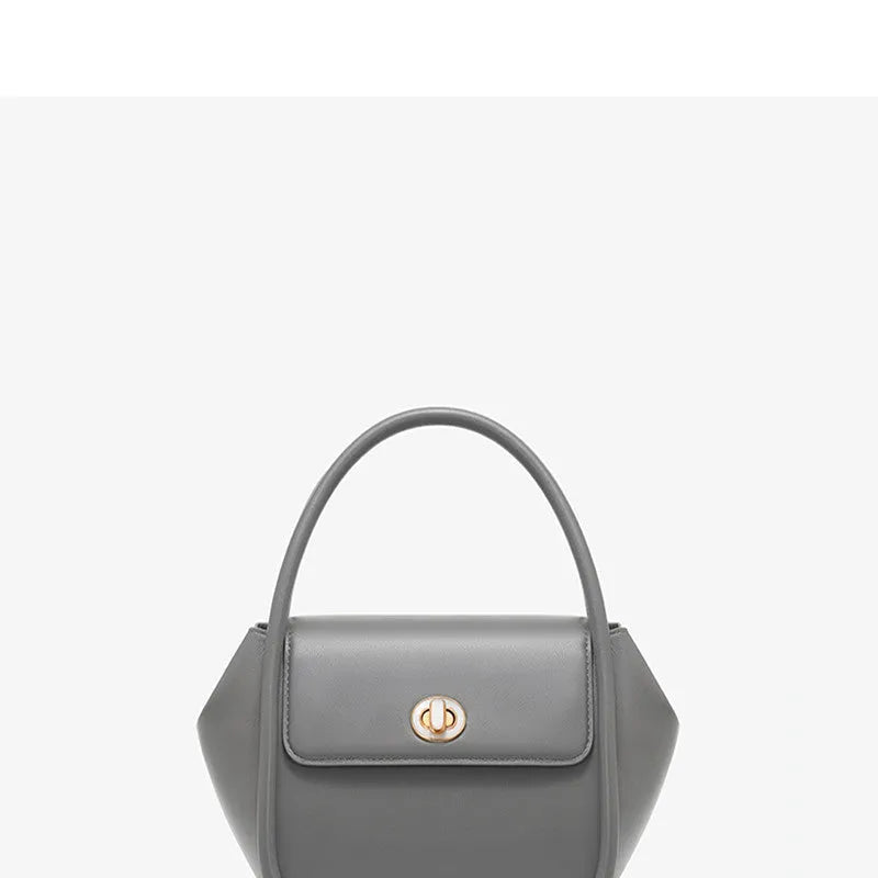Women's leather cross-body wing bag with buckle closure in four colour options