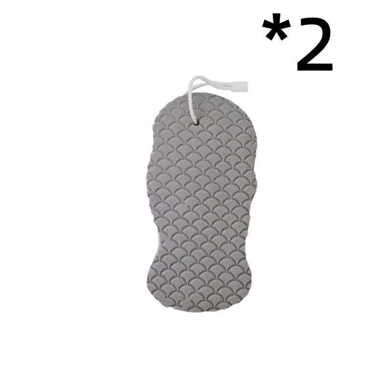 White 3D fish scale pattern bath sponge ball with hanging loop on a grey background.