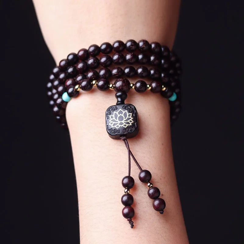 Zambia rosewood Buddha beads bracelet with flat lotus pendant showing 108 beads