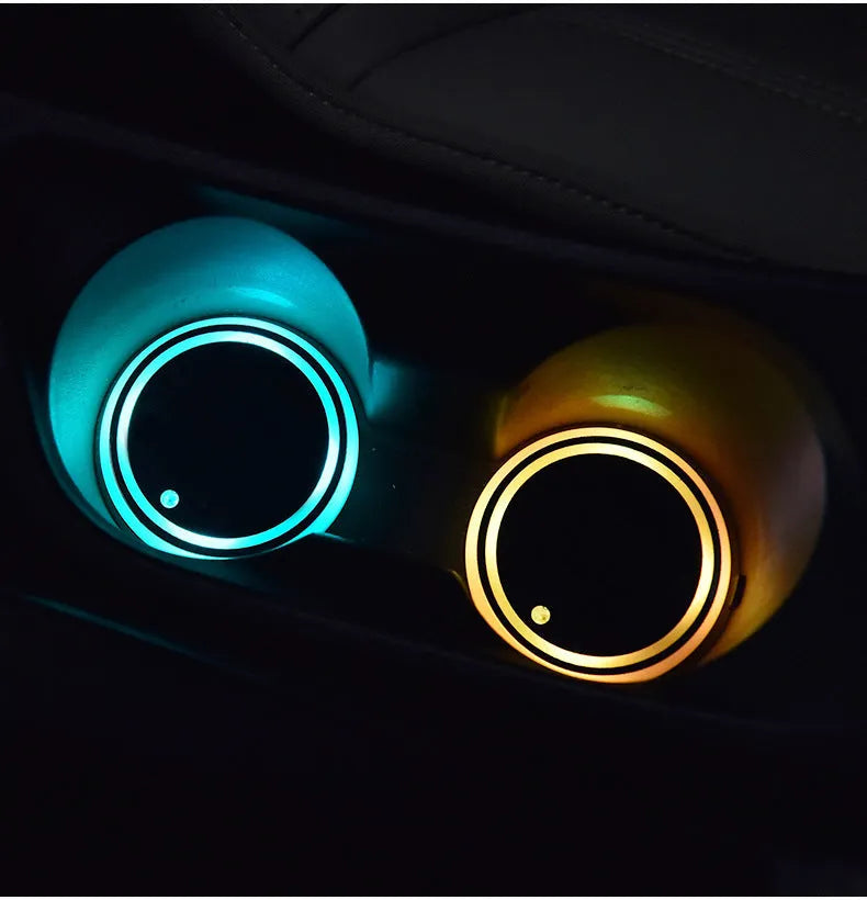 Colourful LED light-up coaster for car cup holders showing seven colour options and USB charging cable