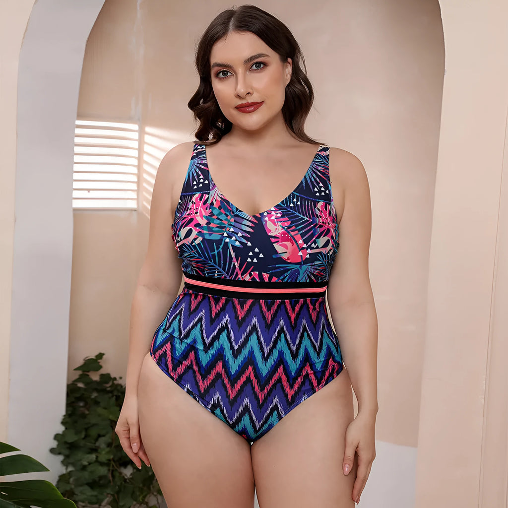 Blue printed one-piece swimsuit with spaghetti straps on a model, showing striped vest design.
