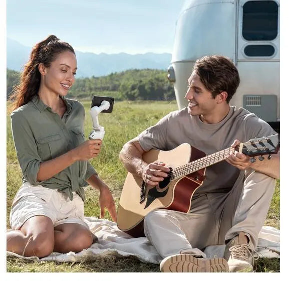 Magnetic phone PTZ gimbal with integrated 2450 mAh power bank for vlogging and handheld video.