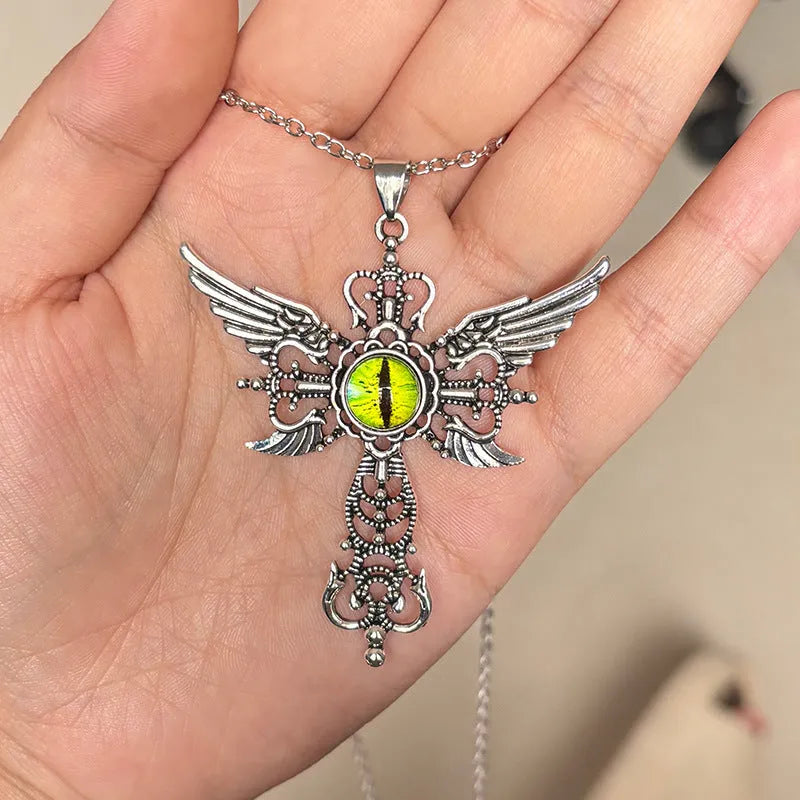 Geometric devil wings and cross alloy pendant necklace on a chain in blue colour.