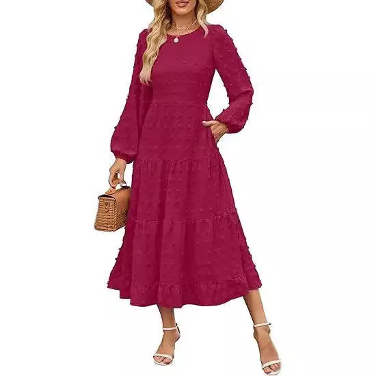 Women's long sleeve dress with ruffled sleeves and high waist in a solid colour.