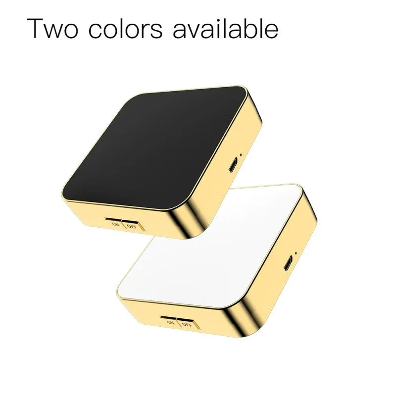 Black and white makeup mirror with dual magnification surfaces and adjustable lighting controls
