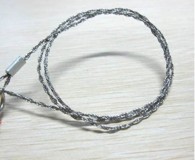 Stainless steel survival wire saw with pull rings showing 55cm cutting length