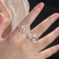 Adjustable open mouth ring with three-dimensional jasmine flower design and electroplated finish