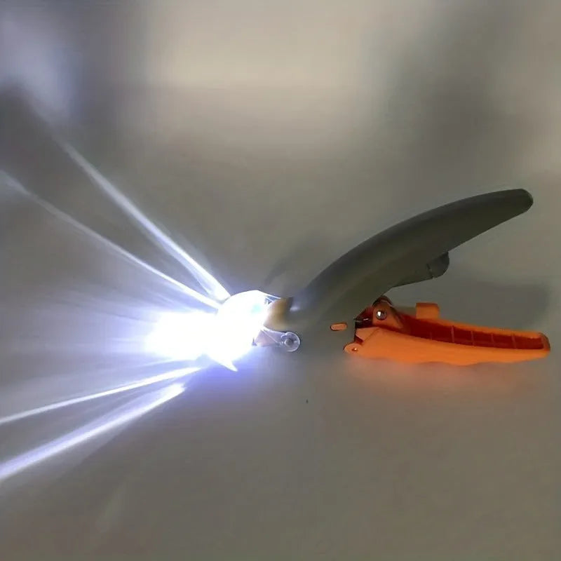 Yellow LED pet nail trimmer with magnifying glass and light for trimming cat and dog nails.