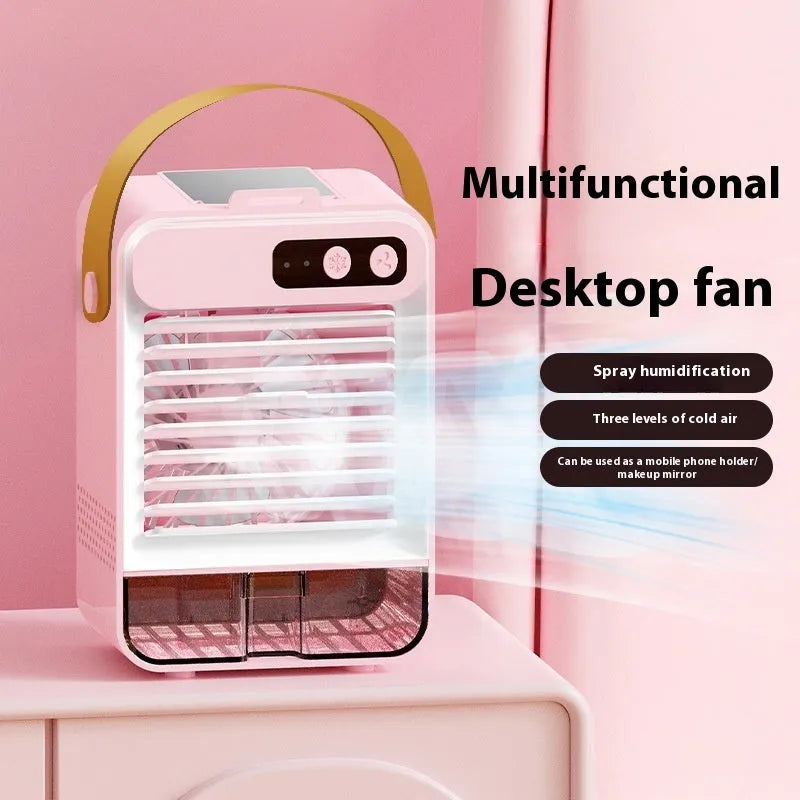 Dark green and ivory white coloured small USB desktop fan with 5 blades on a desk.