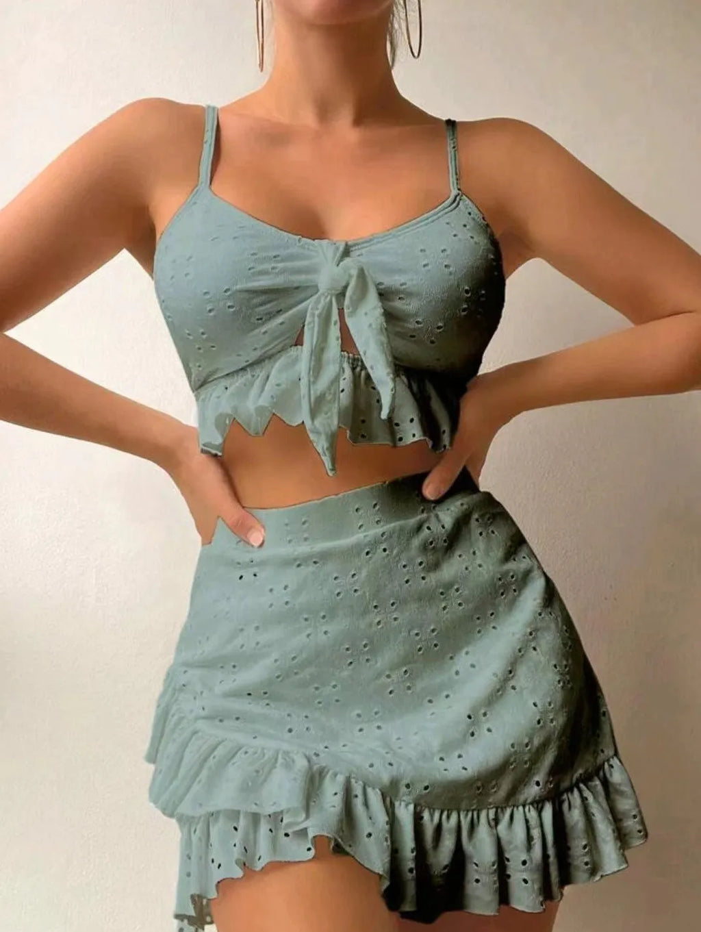 Women's three-piece bikini swimsuit with split hip skirt in polyester fabric